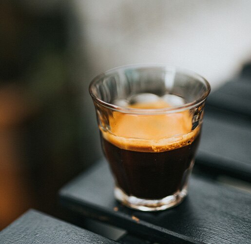 glass with coffee on a table